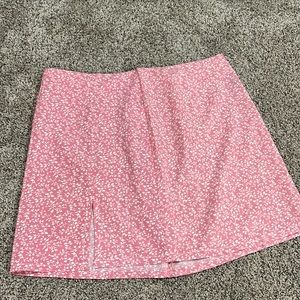 pink mini skirt with slit and white floral detailing zipper in the back
